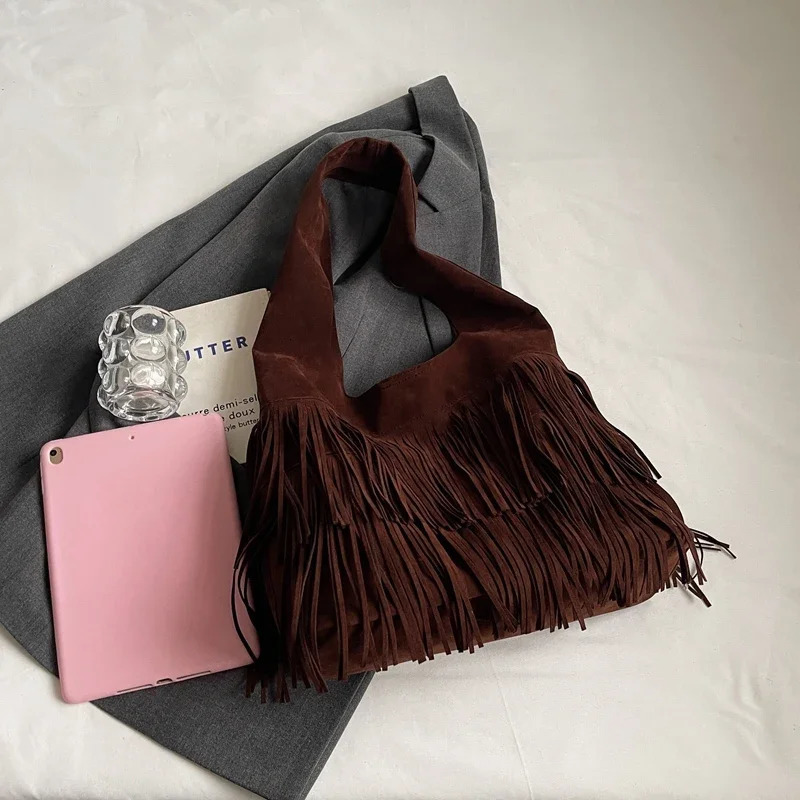 Solid and fashionable PU shoulder bag with tassel large capacity buckle sewing thread casual handbag selling womens bag 240930