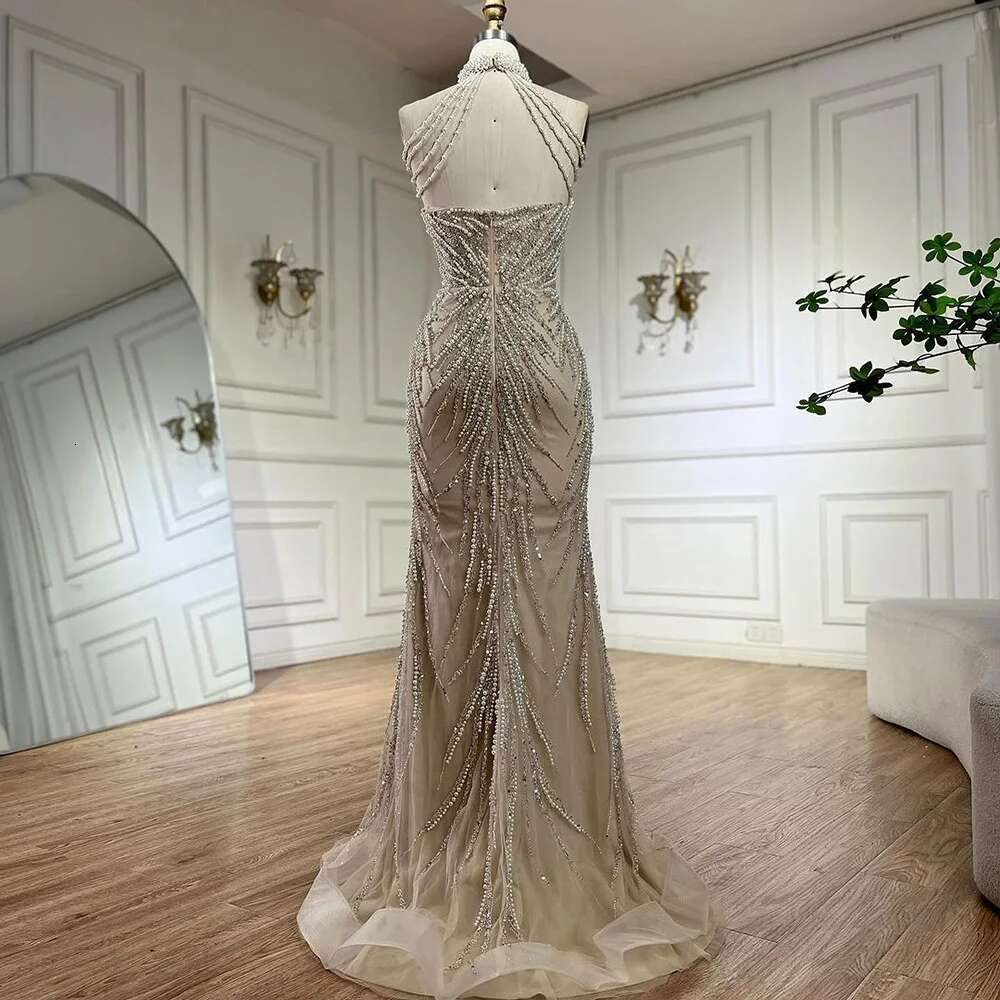 Wasisi 2024 Arabic Nude Halter Neck Mermaid Pearls Beaded Dubai Evening Gown for Women's Party ELA72696