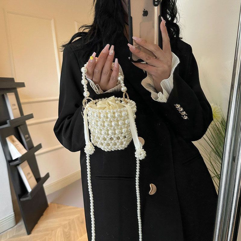 Fairy 2024 new designer handbag fashion fragrance woven pearl handbag fashion horizontal hollow bag
