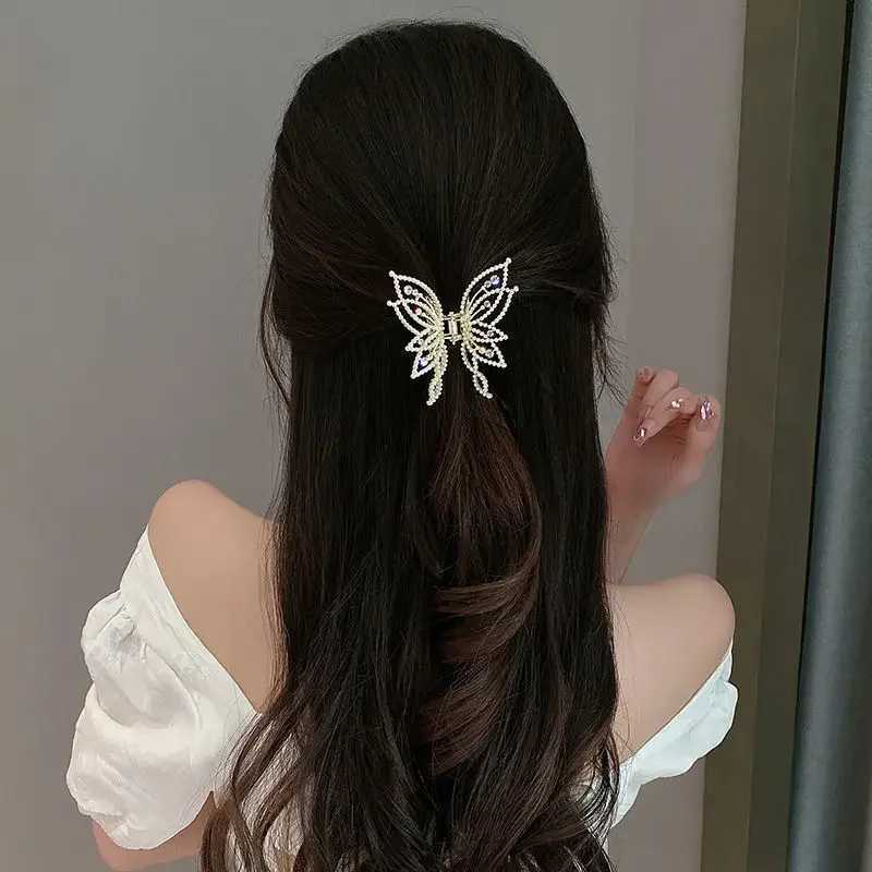 Korean style elegant warm pearl rhinestone high-end womens shark clip metal hollow butterfly grip clip half tied hair W241007