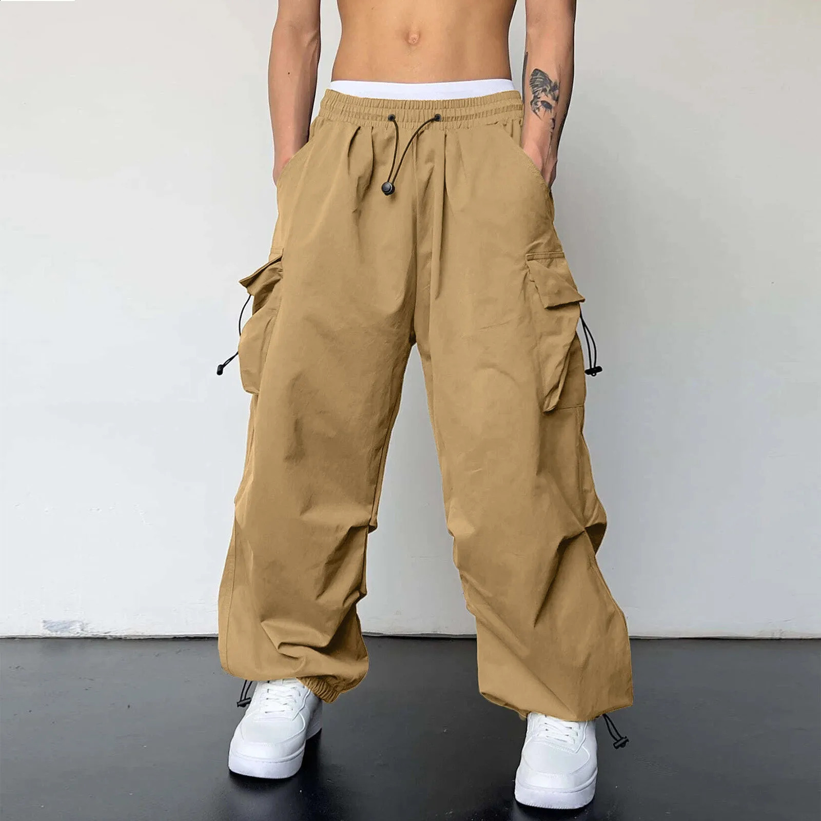 Streetwear mens cargo pants multi woven pockets foot ropes hip-hop bags mens solid pull rod umbrella pants mens clothing 240924