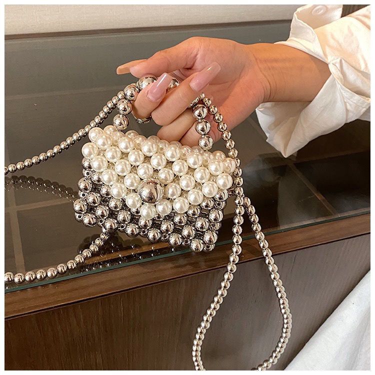 2024 new designer handbag pearl handbag women's niche handmade high-end multifunctional pearl shoulder chain small bag ins crossbody bag