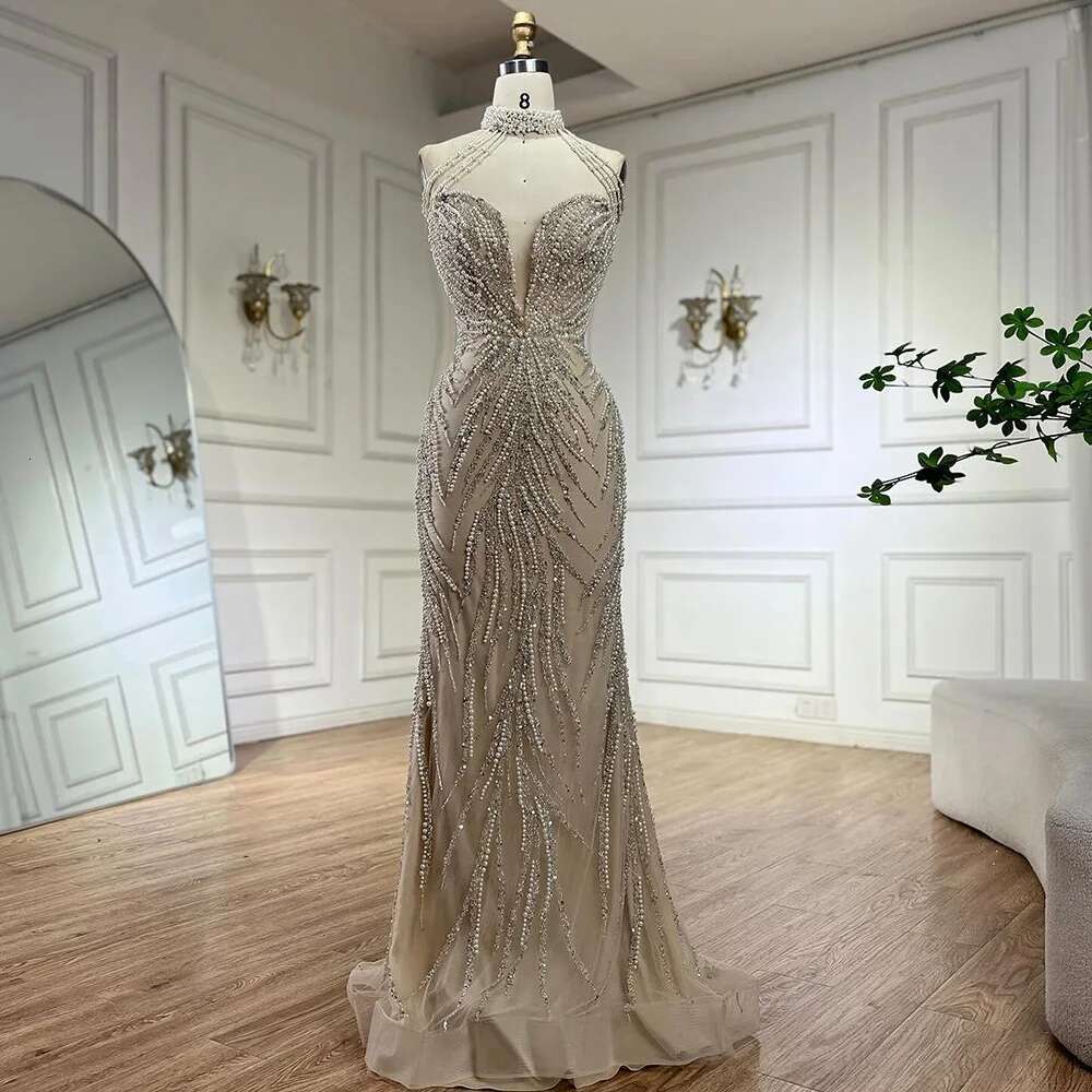 Wasisi 2024 Arabic Nude Halter Neck Mermaid Pearls Beaded Dubai Evening Gown for Women's Party ELA72696