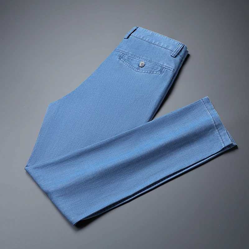 2024 Spring/Summer New Mens Thin Light Blue Loose Jeans Commercial Fashion Lyocell Fabric Elastic Denim Trouser Mens Brand PantsW240715