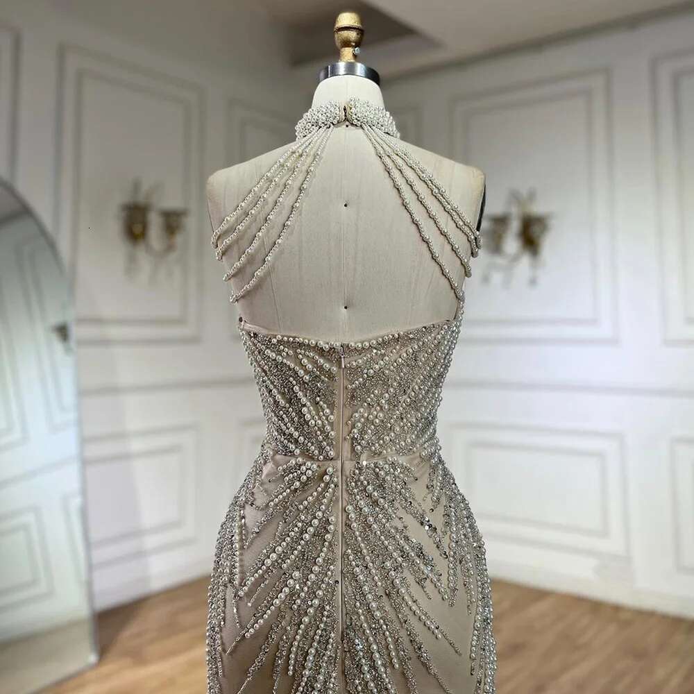 Wasisi 2024 Arabic Nude Halter Neck Mermaid Pearls Beaded Dubai Evening Gown for Women's Party ELA72696