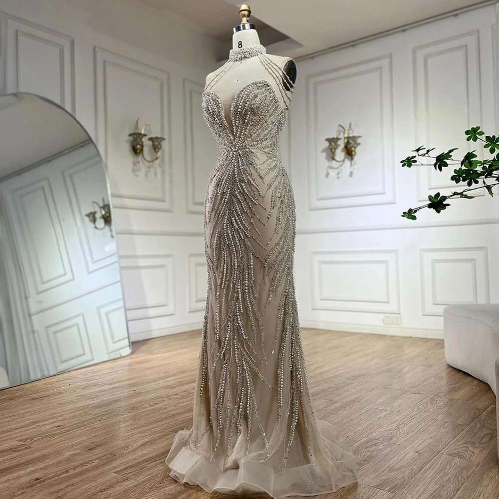 Wasisi 2024 Arabic Nude Halter Neck Mermaid Pearls Beaded Dubai Evening Gown for Women's Party ELA72696