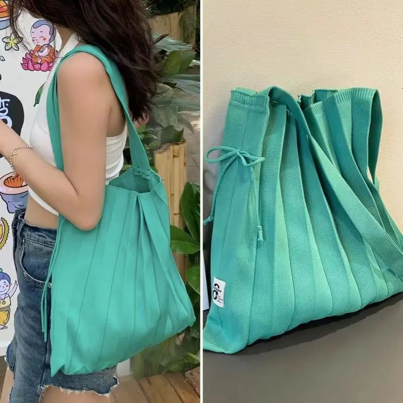 Korean niche pleated shoulder bag shopping bag spring/summer folding knitted large portable womens organ bag 241008