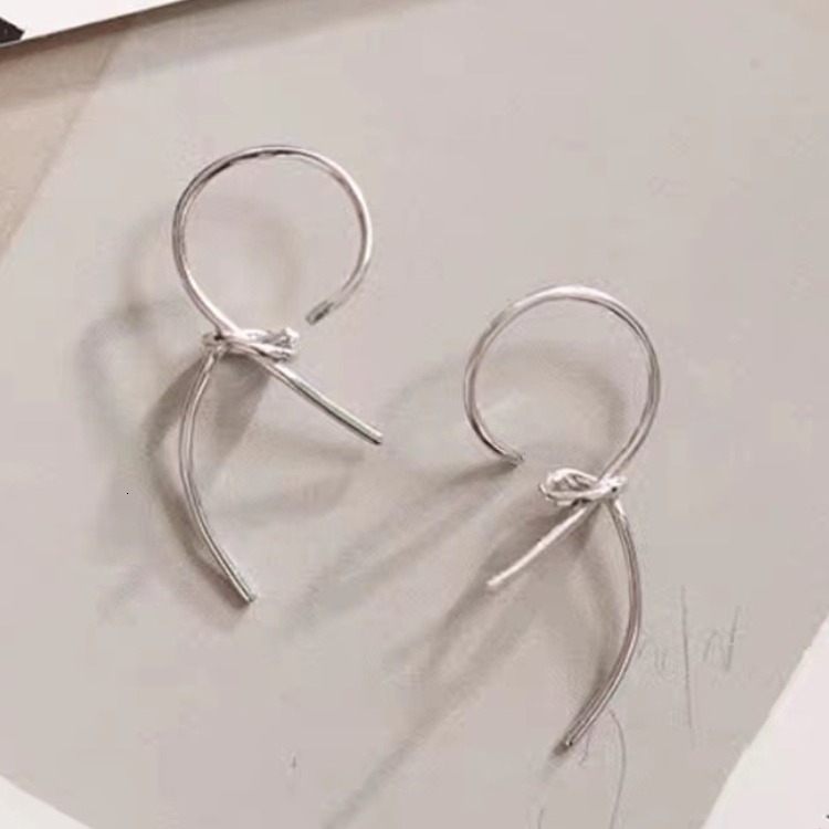 Pure sier needle knotted ribbon trendy women's ear accessories, simple and cool style earrings, earrings