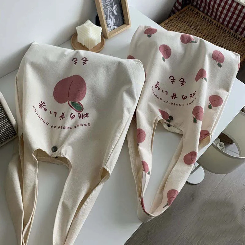 Peach Canvas handbag wallet and tote bag suitable for female shoppers. Cute shoulder bag Japanese Kawaii style printed eco bag 241008
