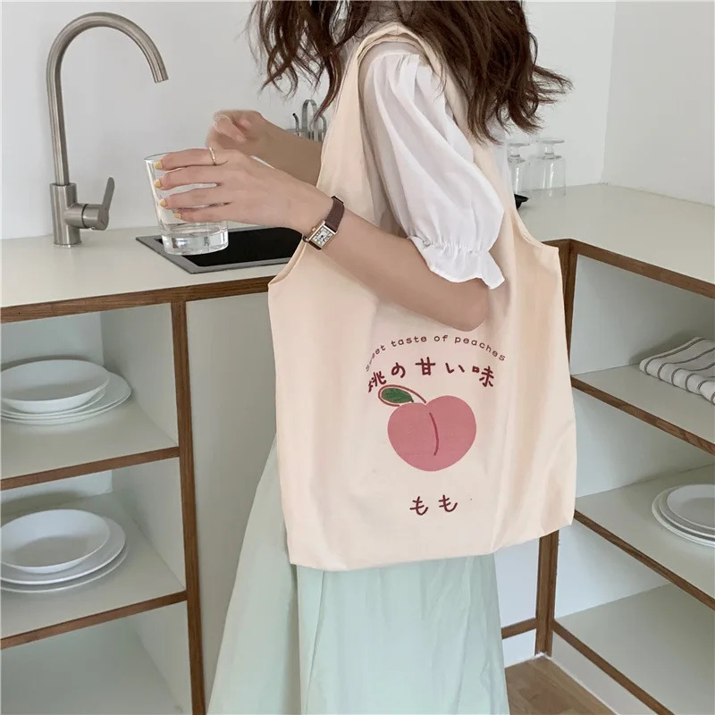 Peach Canvas handbag wallet and tote bag suitable for female shoppers. Cute shoulder bag Japanese Kawaii style printed eco bag 241008