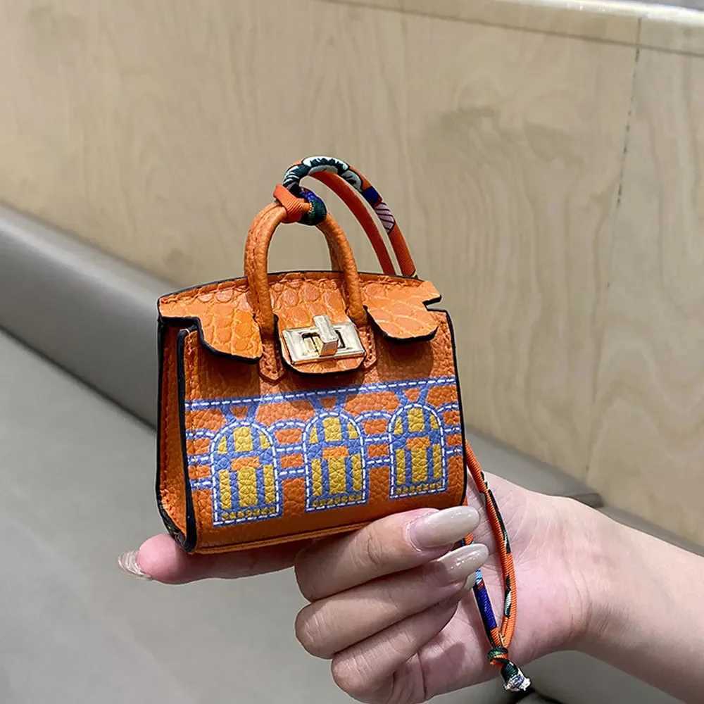 Keychains Lanyards 2024 Mini Bag Pendant Crocodile Pattern Exquisite Variation High end Earplug Red Mouth Charter Keychain H241010