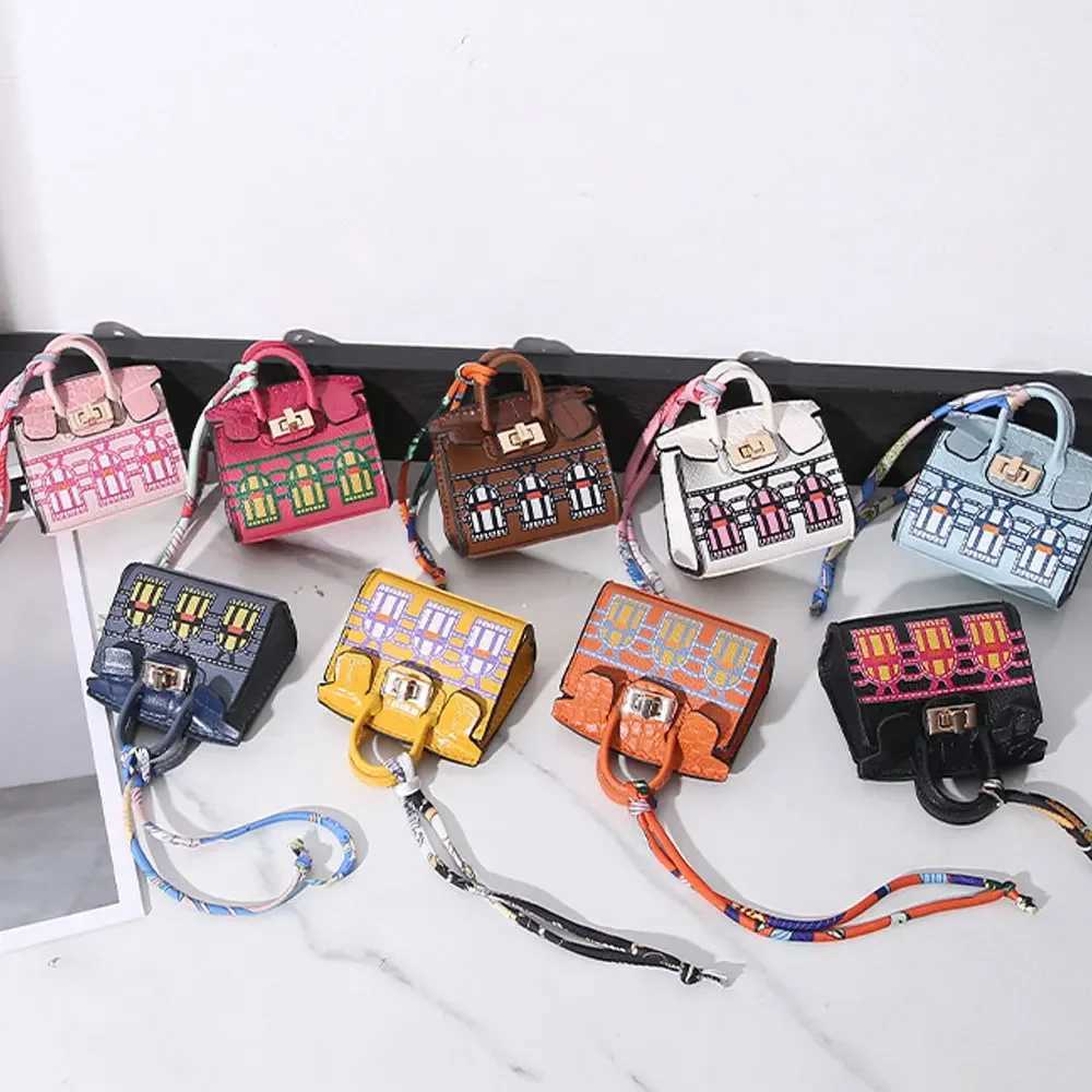 Keychains Lanyards 2024 Mini Bag Pendant Crocodile Pattern Exquisite Variation High end Earplug Red Mouth Charter Keychain H241010