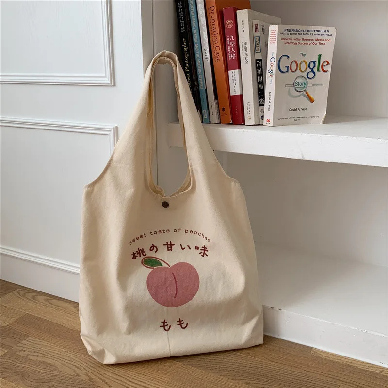 Peach Canvas handbag wallet and tote bag suitable for female shoppers. Cute shoulder bag Japanese Kawaii style printed eco bag 241008