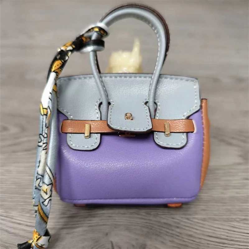 Keychains Lanyards Fashionable mini patchwork leather bag ladies cute headphone keychain H241010