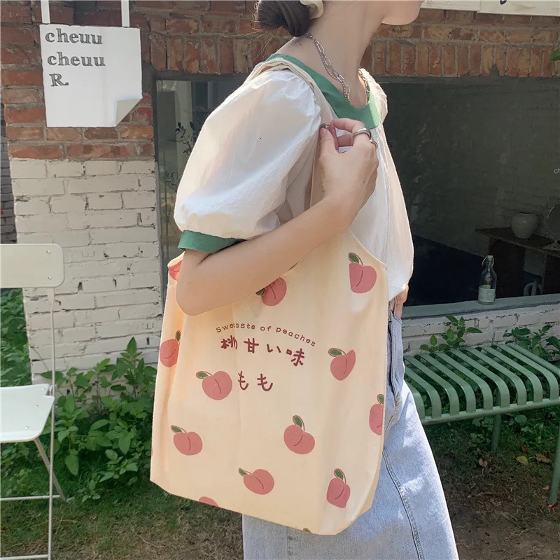 Peach Canvas handbag wallet and tote bag suitable for female shoppers. Cute shoulder bag Japanese Kawaii style printed eco bag 241008