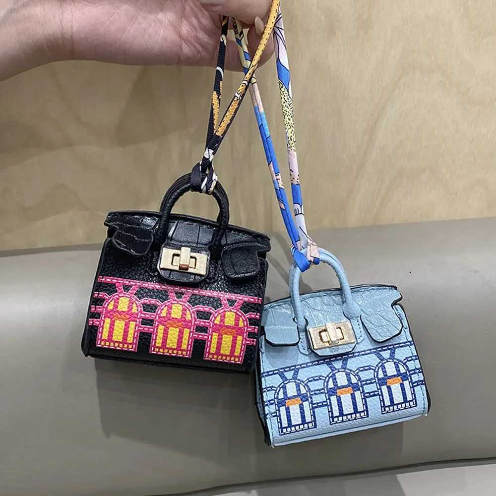 Keychains Lanyards 2024 Mini Bag Pendant Crocodile Pattern Exquisite Variation High end Earplug Red Mouth Charter Keychain H241010