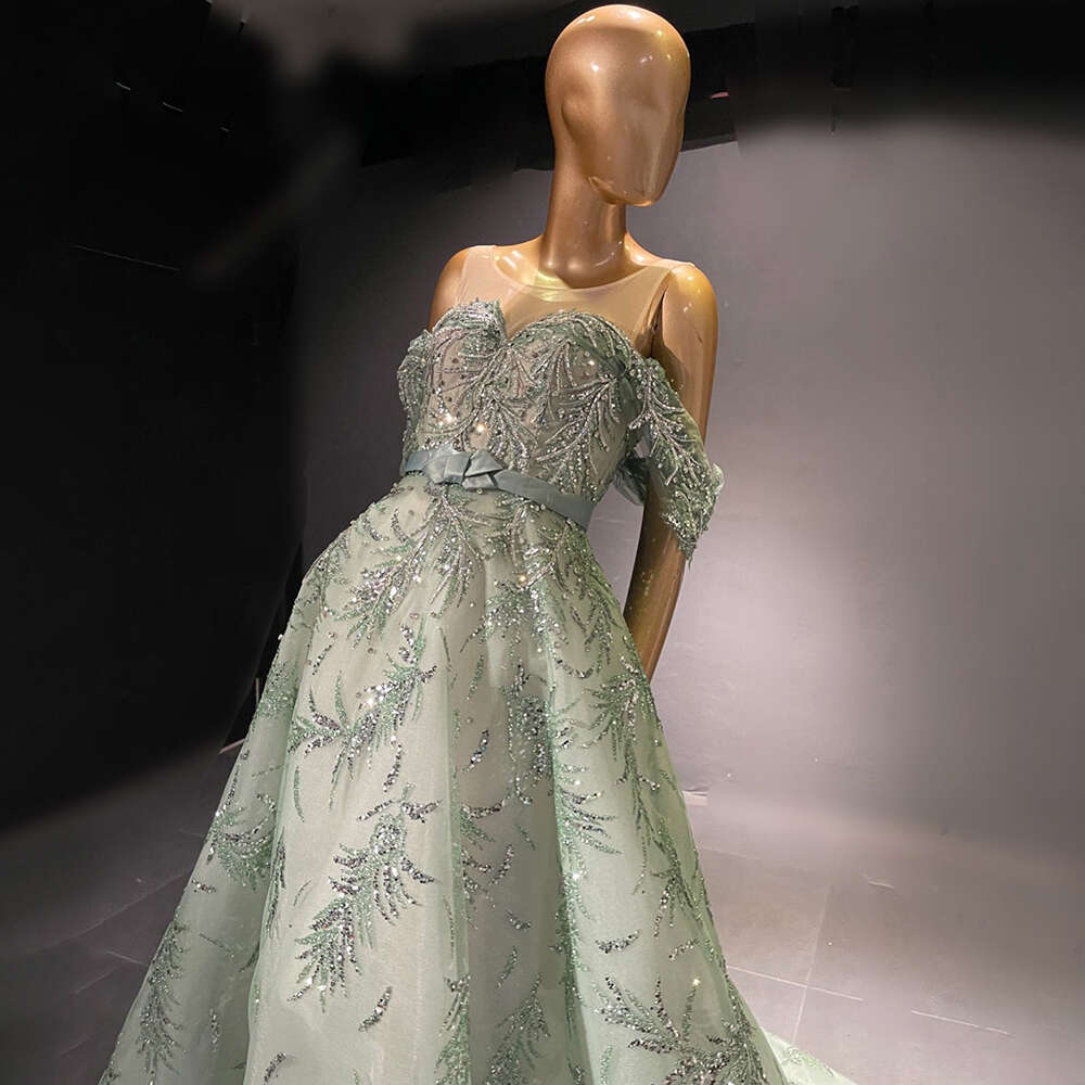 2024 Sexy Mermaid Prom Gowns High Neck Long Sleeves Hand Beaded Applique Feather Evening Party Dress