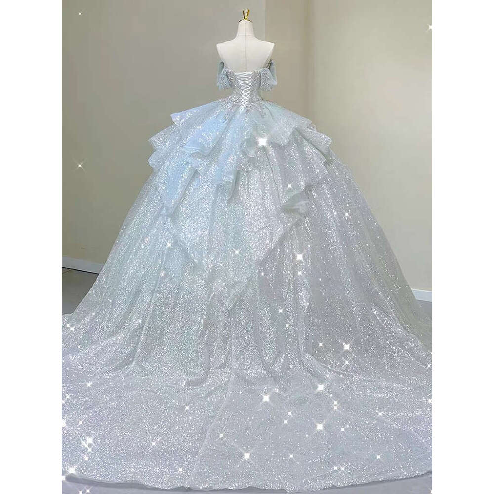 Light Blue Wedding Dresses Off The Pearl Sleeveless Shiny Beading Sexy Backless Sweep Train Bridal Gowns Boat Neck