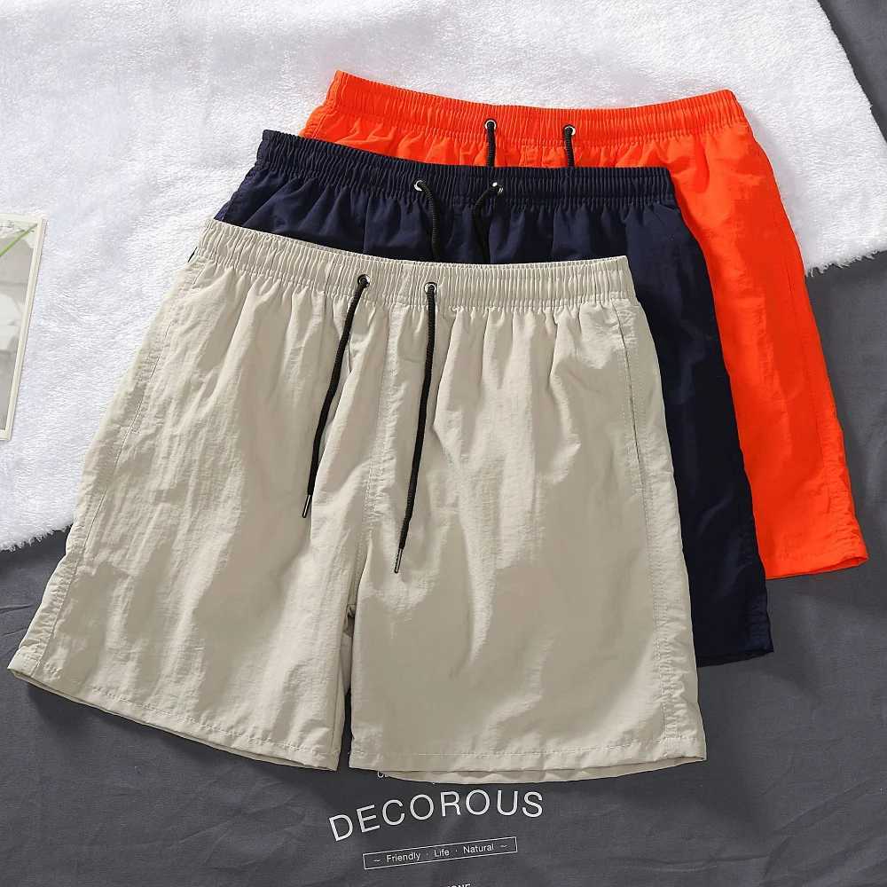 Mens shorts 2024 summer thin new hot solid casual beach shorts mens running fitness breathable sports five point pants W241010