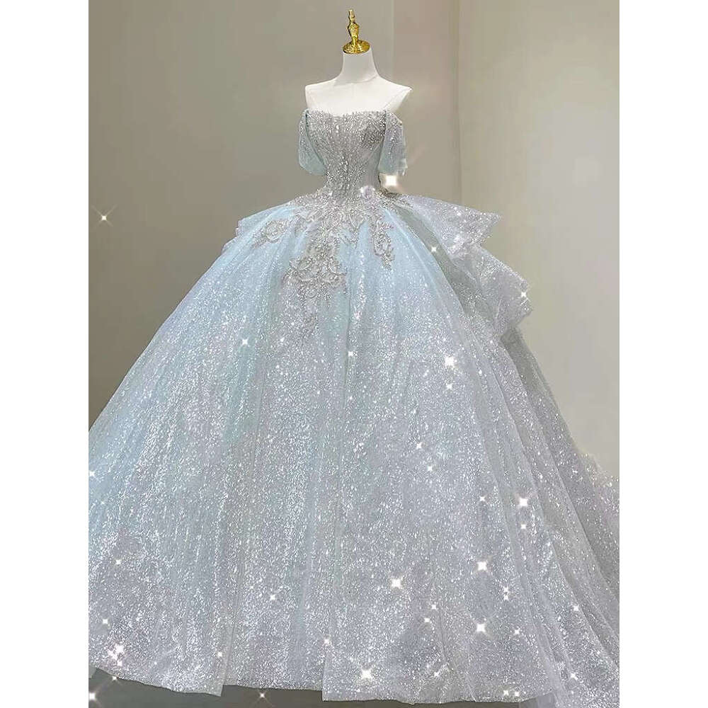 Light Blue Wedding Dresses Off The Pearl Sleeveless Shiny Beading Sexy Backless Sweep Train Bridal Gowns Boat Neck