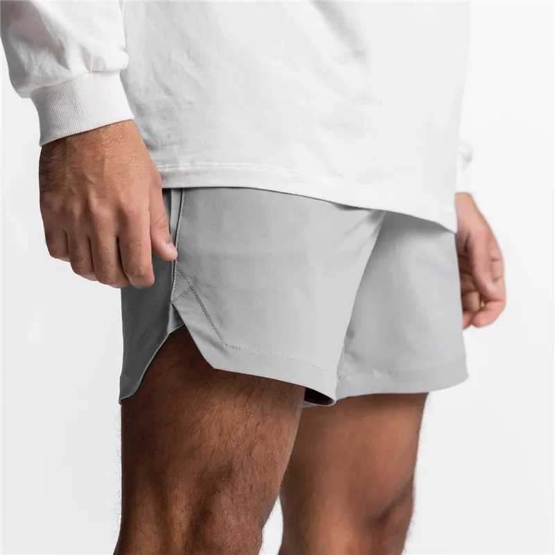 Summer new gym jogging shorts mens sports fitness fast drying multi pocket running shorts woven mens casual shorts W241010