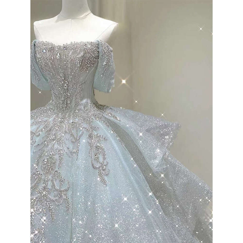 Light Blue Wedding Dresses Off The Pearl Sleeveless Shiny Beading Sexy Backless Sweep Train Bridal Gowns Boat Neck