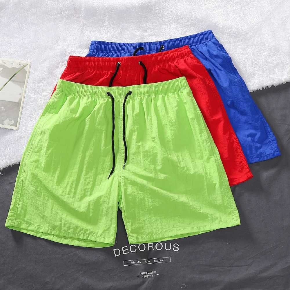 Mens shorts 2024 summer thin new hot solid casual beach shorts mens running fitness breathable sports five point pants W241010