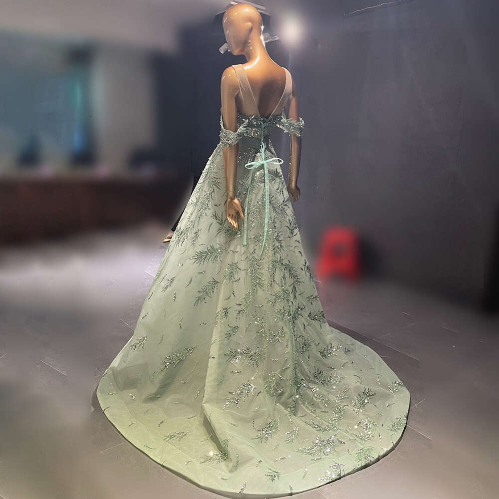 2024 Sexy Mermaid Prom Gowns High Neck Long Sleeves Hand Beaded Applique Feather Evening Party Dress
