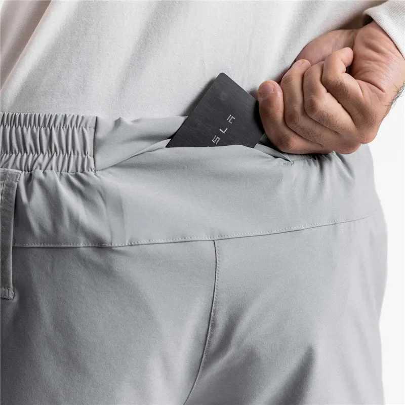 Summer new gym jogging shorts mens sports fitness fast drying multi pocket running shorts woven mens casual shorts W241010