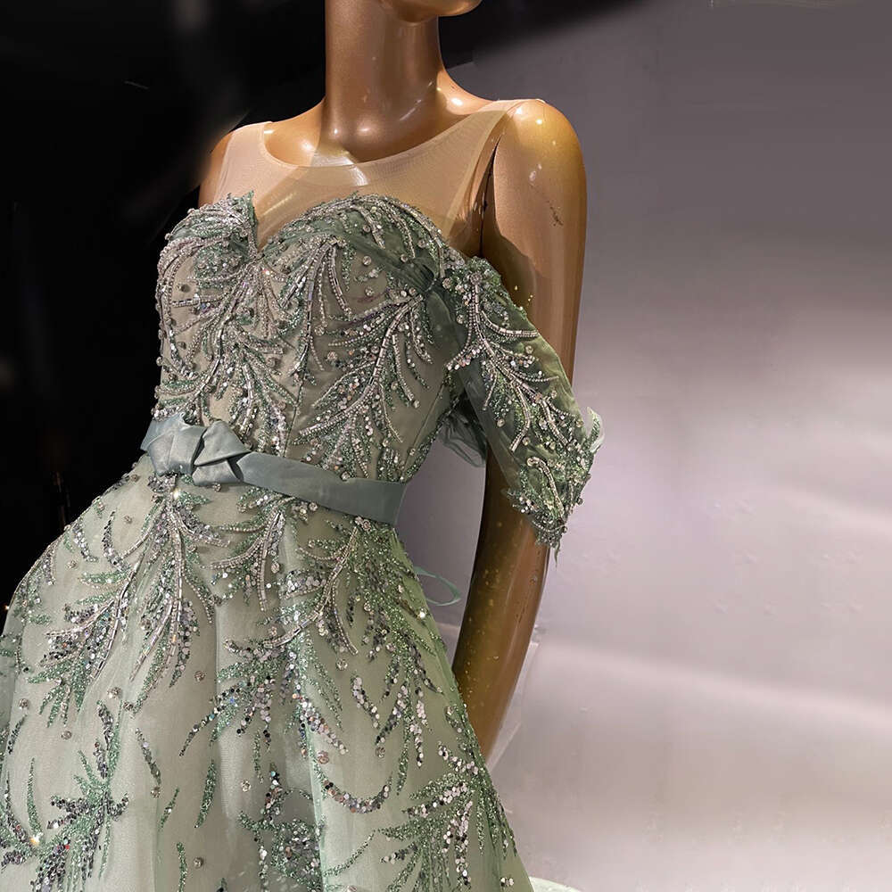 2024 Sexy Mermaid Prom Gowns High Neck Long Sleeves Hand Beaded Applique Feather Evening Party Dress