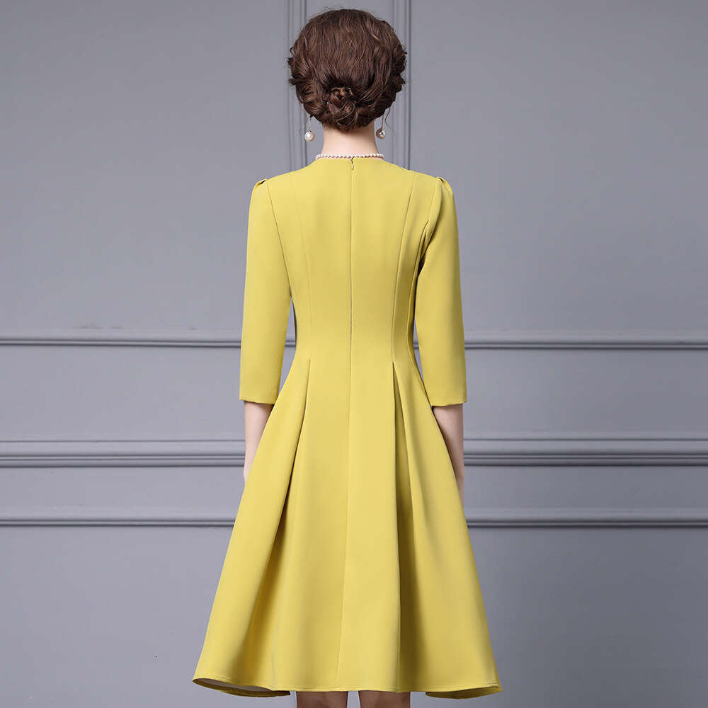 Smart yellow gentle socialite temperament big umbrella skirt high-end luxury nail diamond round neck high waisted dress autumn 2024