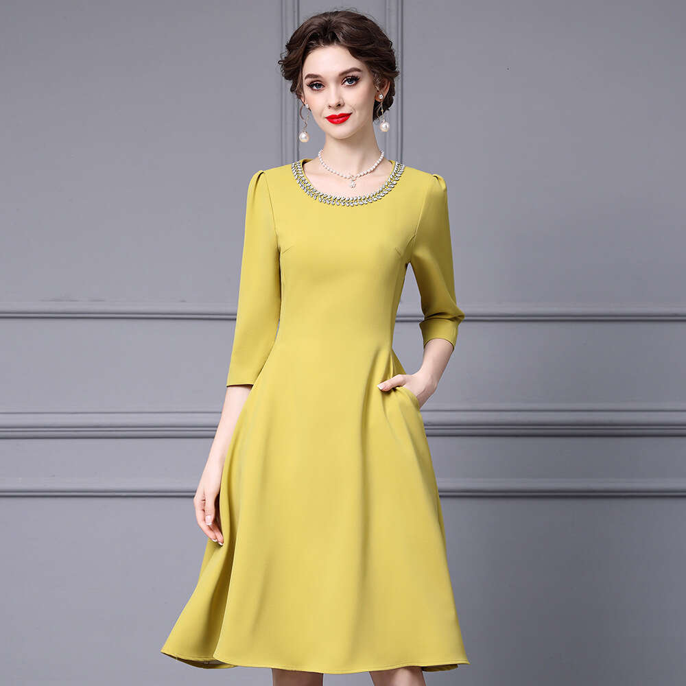 Smart yellow gentle socialite temperament big umbrella skirt high-end luxury nail diamond round neck high waisted dress autumn 2024