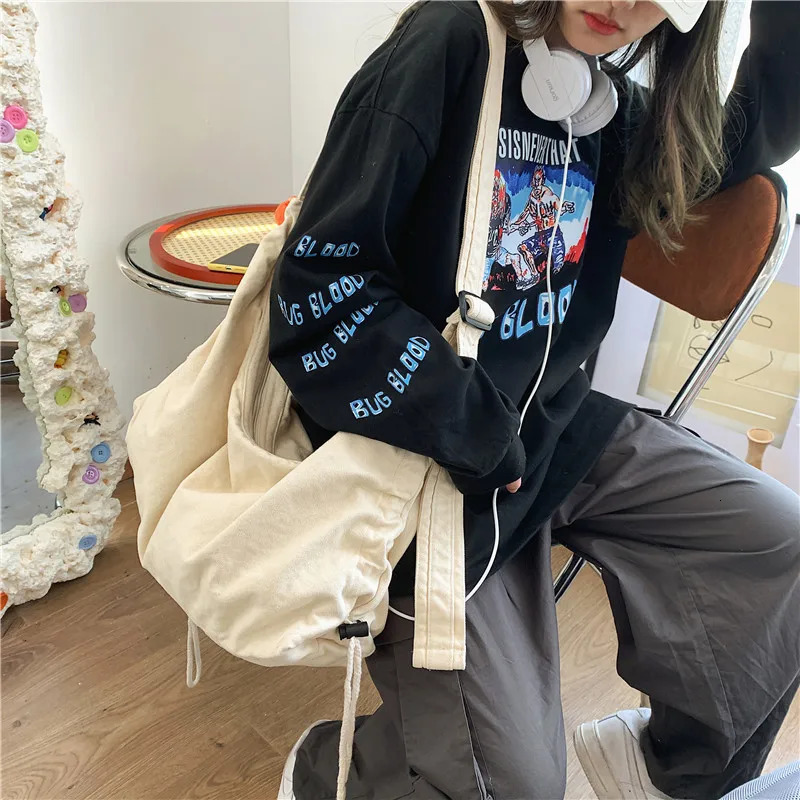 Original Korean Ins messenger canvas bag womens fashion large capacity Japanese student shoulder Ins diagonal garbage bag 241008