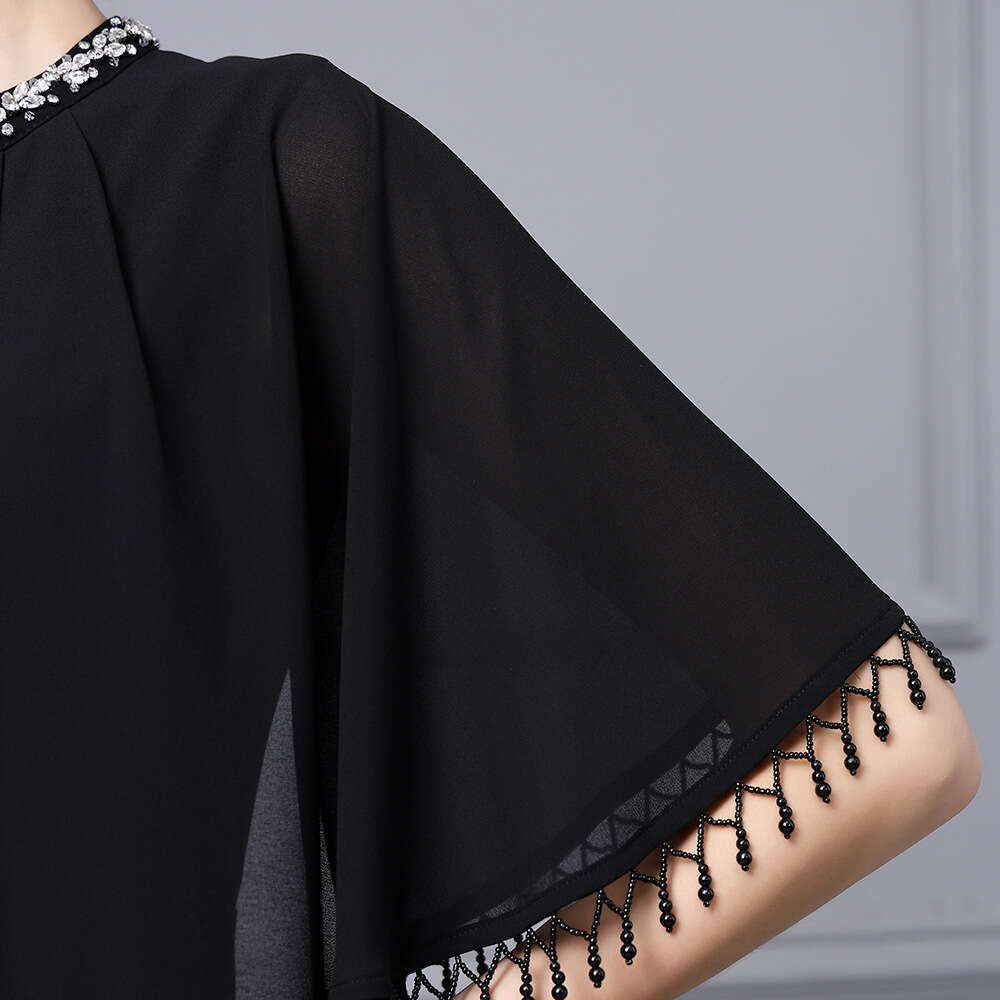 Smart stylish dress exuding an elegant figure socialite temperament. Tassel cape shawl and hip hugging dress