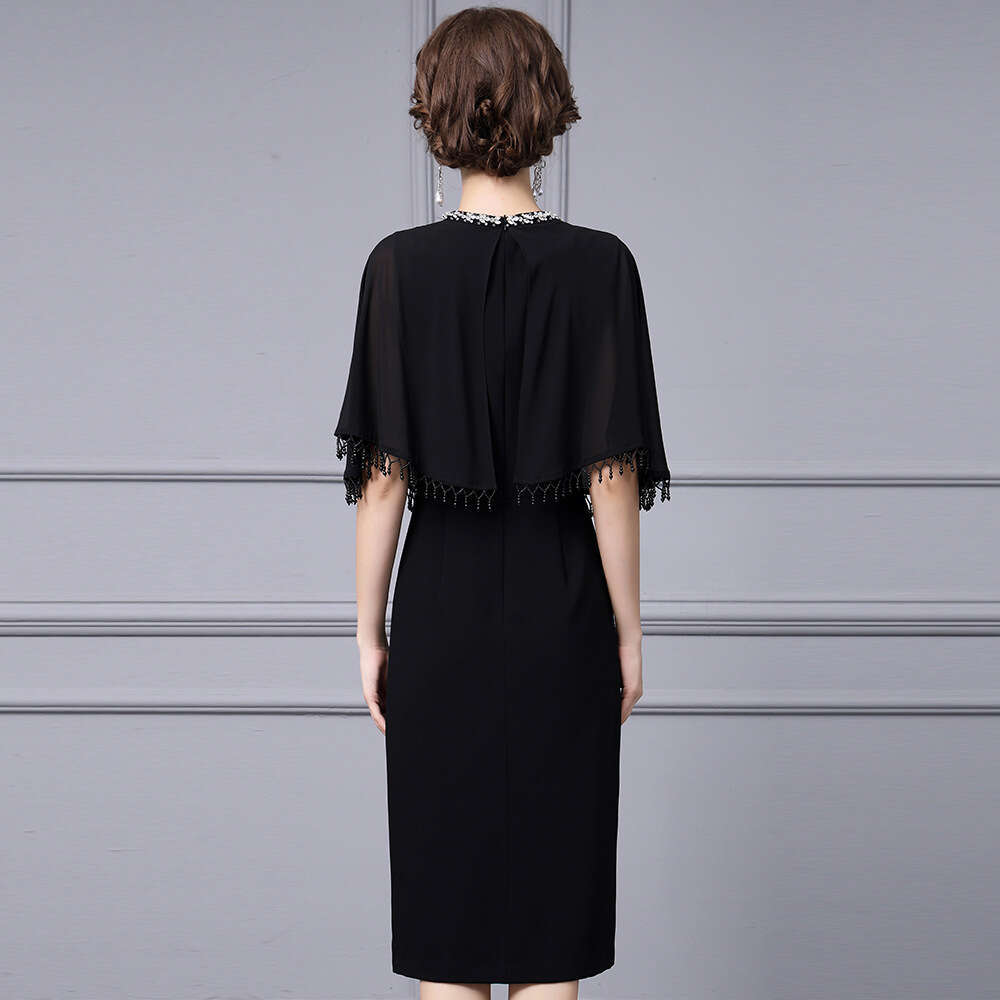 Smart stylish dress exuding an elegant figure socialite temperament. Tassel cape shawl and hip hugging dress