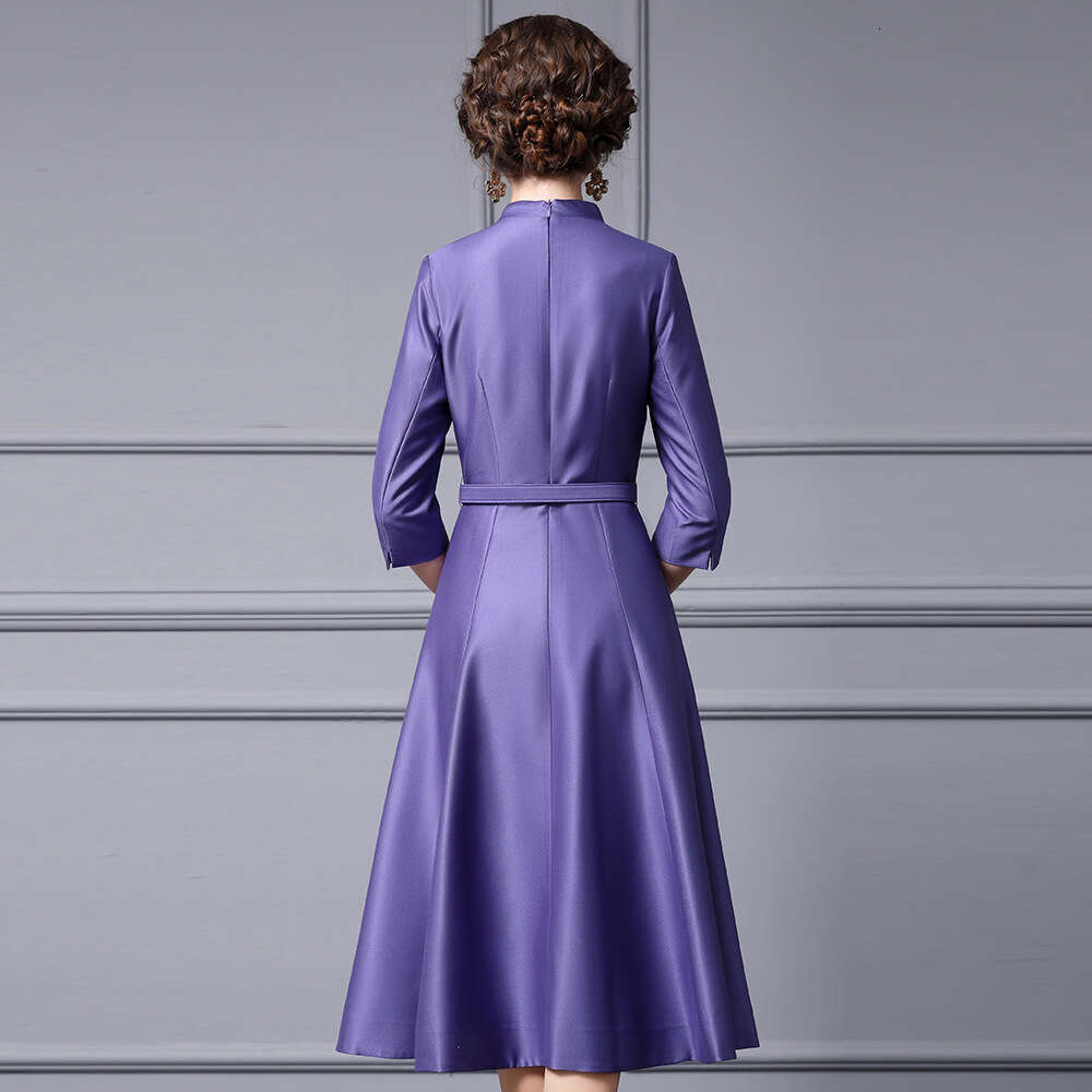 Smart purple mature charm big swing for spring summer 2024 with three quarter sleeves waist cinching revealing a slim and small lapel dress