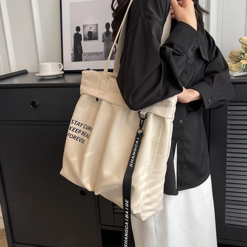 Korean casual canvas handbag womens large capacity letter bottom arm shoulder bag Ins fashion student handbag 241008