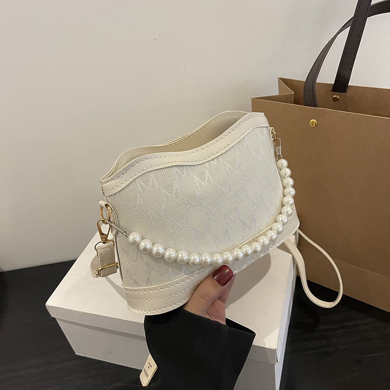 Pearl chain armpit spring new French niche design fashionable single shoulder cross body small square bag