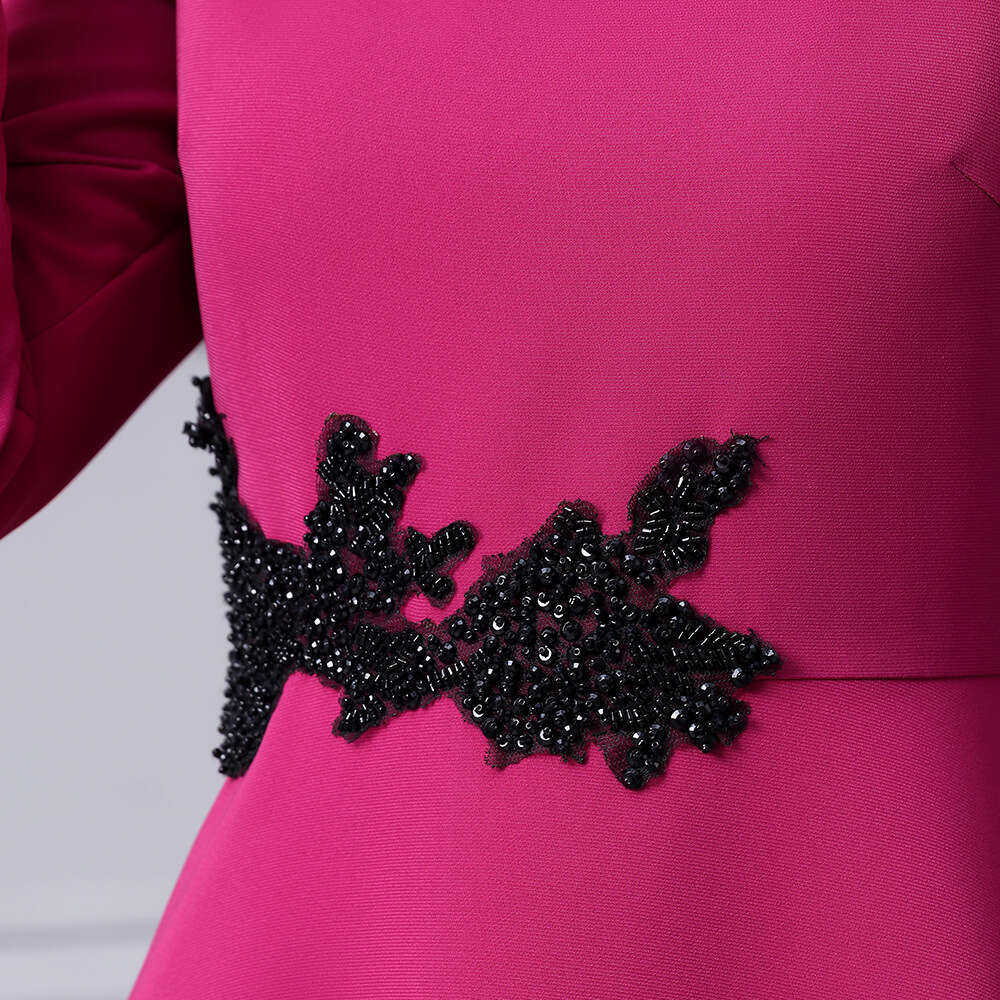 waist studded diamonds exudes sense of luxury elegance with slim fit slimming effect. The dress features nine quarter sleeves a large swing square