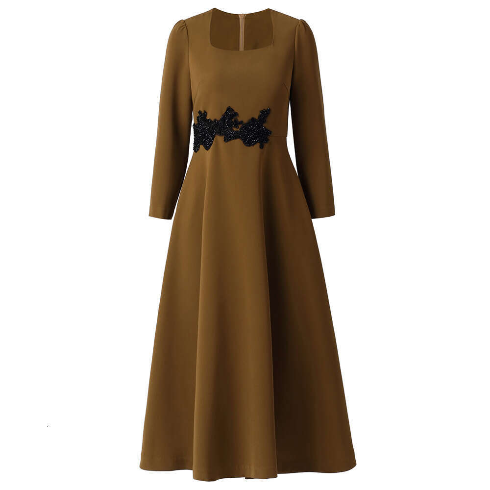 waist studded diamonds exudes sense of luxury elegance with slim fit slimming effect. The dress features nine quarter sleeves a large swing square