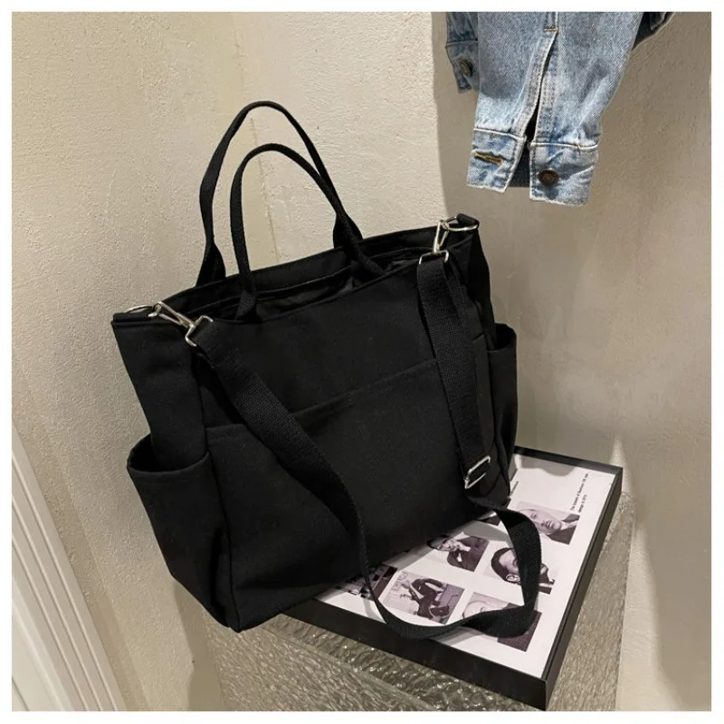 Womens large capacity fashionable canvas bag Korean style retro simple commuting casual shoulder messenger bag 241008