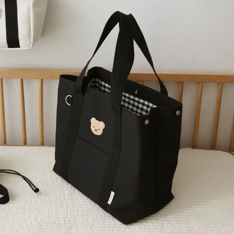 Korean large capacity mother bag mother bag smallest canvas handbag baby stroller hanging bag handbag 241008