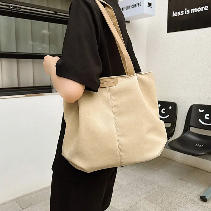 Solid color large capacity canvas handbag for womens Japan Leisure Ins College student class shoulder bag 241007