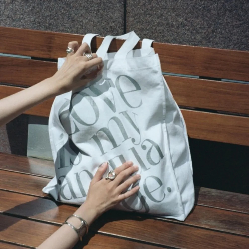 Panel large capacity casual shoulder bag for womens printed letter commuting practical single shoulder matching Korean canvas bag 241008