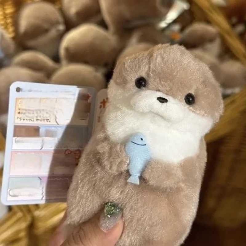 Cartoon cute otter holding fish plush doll with creative chain Kawaii keychain pendant jewelry school bag wallet charm Y241014