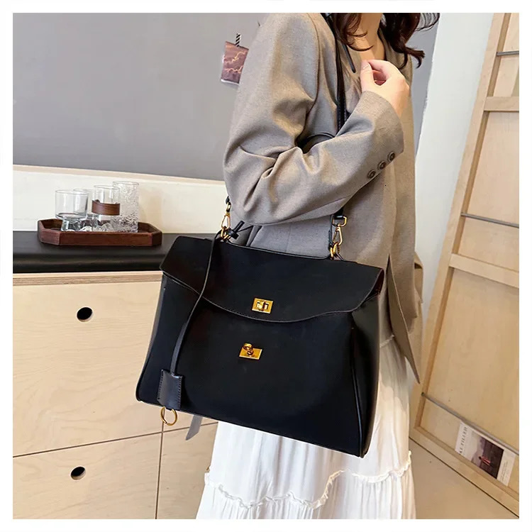 suede womens handbag retro cross shaped bag retro lock large barrel shoulder bag 241011