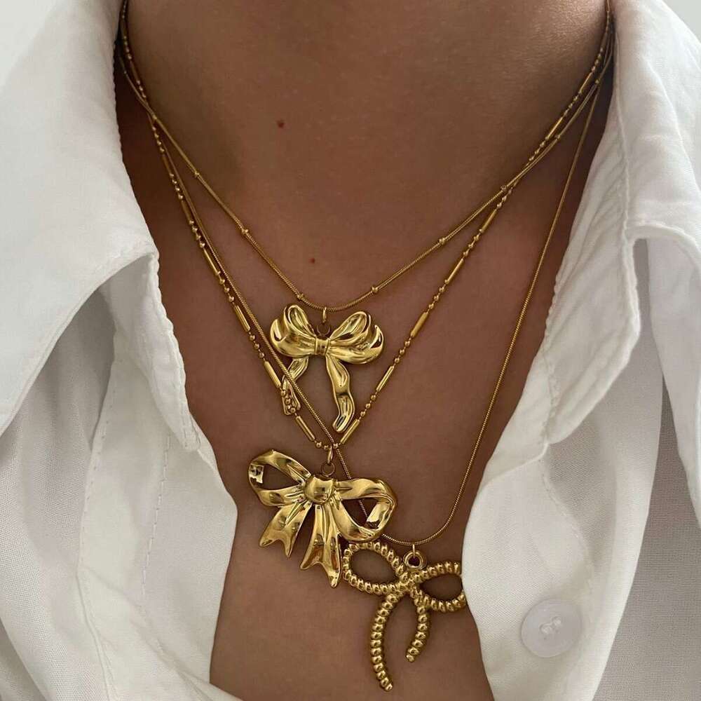 New stainless steel bow pendant necklace with metallic style light fashionable and high-end design for women's fashion