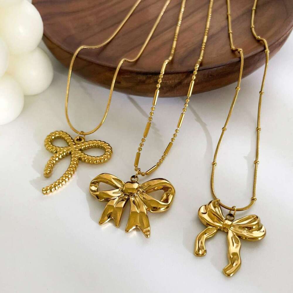 New stainless steel bow pendant necklace with metallic style light fashionable and high-end design for women's fashion