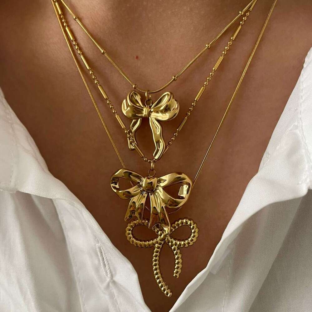 New stainless steel bow pendant necklace with metallic style light fashionable and high-end design for women's fashion
