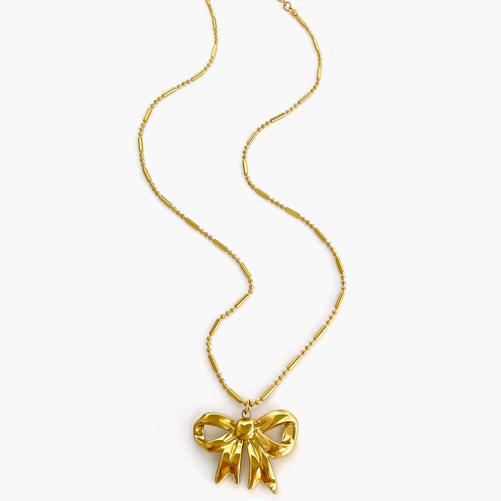 New stainless steel bow pendant necklace with metallic style light fashionable and high-end design for women's fashion